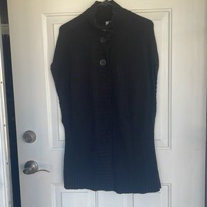 Black sleeveless sweater vest.